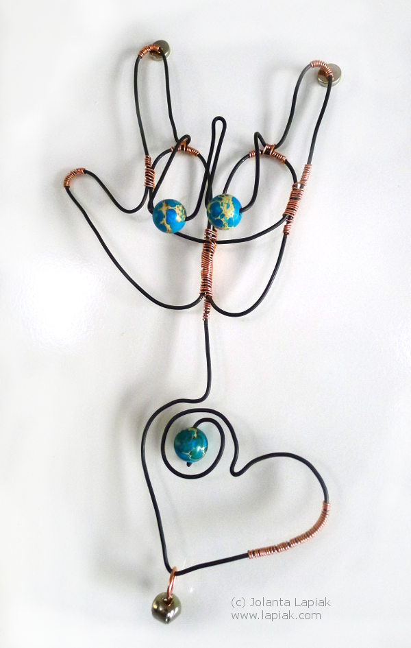 ILY handshape with heart and earth beads in wire art